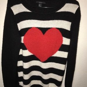 Black and white striped sweater with a red heart